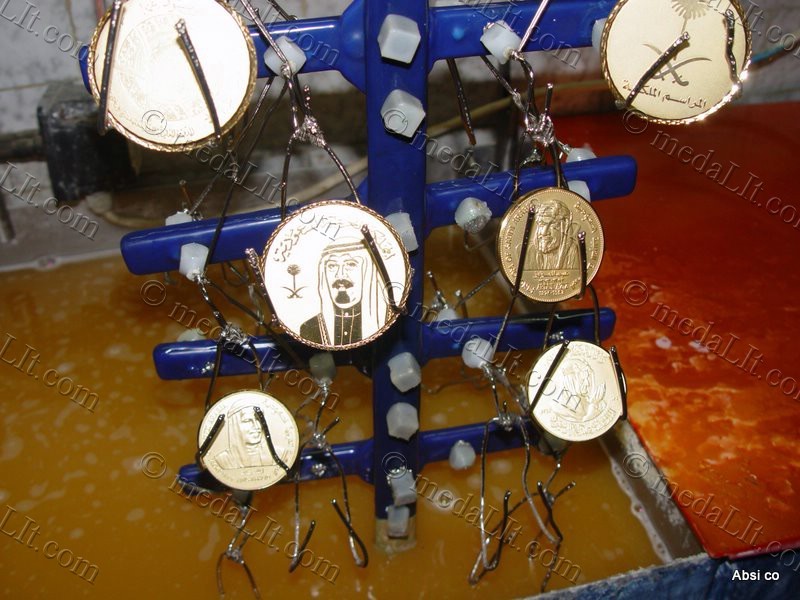 A gold-plating rack carrying medals.